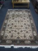 A fringed Persian machine made carpet