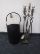 A four piece companion set on stand and a coal bucket