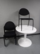 A white office table and five Narbutas stacking chairs