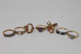 A gold cameo ring, amethyst solitaire ring,