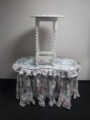 A mid 20th century kidney shaped two drawer glass topped chest and an occasional table