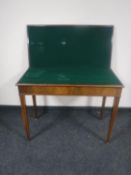 A 19th century mahogany foldover tea table
