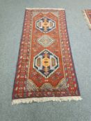 A Caucasian design runner on red ground,