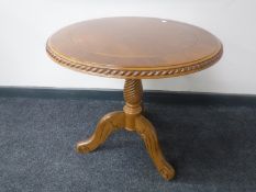 An oval oak barley twist occasional table and a walnut effect wine table