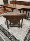 A Victorian carved oak lozenge shaped gateleg table, width 85 cm.