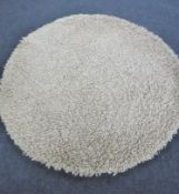 A hand knotted shaggy natural rug,