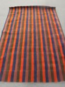 A hand-knotted rug of striped design in four colours,