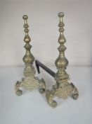 A pair of Victorian brass fire dogs
