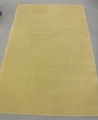 A hand-knotted rug with embossed pattern on green ground,