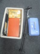 A wicker basket containing a large quantity of art supplies together with an easel