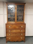 A George III inlaid mahogany secretaire bookcase, with later astragal glazed top,