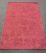 A hand-knotted rug in purple,