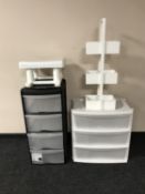 Three plastic storage chests together with a wooden caddy and a plastic stool