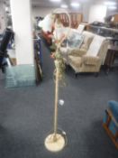 A two-way standard lamp with glass shades leaf design