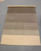 A hand-knotted rug of striped design,