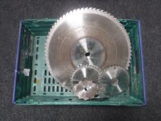 A crate of seven circular saw blades,