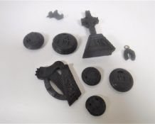 Nine items of antique bog oak including harp, toggles, scottie dog, crucifix etc.