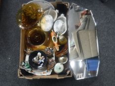 A frameless bevelled mirror together with a box of antique blue and white tureens,