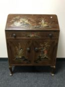 A mid 20th century walnut Chinoiserie writing bureau with matching circular coffee table