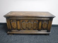 An oak linen fold blanket box