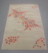 A hand-knotted rug of floral design, on grey ground,