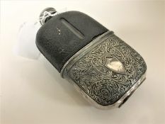 A Victorian hip flask with engraved decoration initialled 'LGM'.