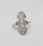 An 18ct white gold diamond ring featuring five bezel set round brilliant cut diamonds 1.