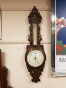 A Victorian carved oak banjo barometer