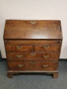A George III oak bureau , width 93 cm.