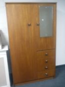 A mid twentieth century teak Symbol furniture combination wardrobe