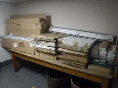 A large quantity of bulkhead fluorescent strip lights together with a box of tubes, ceiling panels,