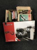 A Next mini cooper racing set together with a box containing weapons and warfare magazines,