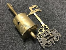 An antique John Lynwood roasting spit with hanging bracket