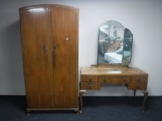 A four piece walnut Queen Anne style bedroom suite comprising of lady's and gent's wardrobe,