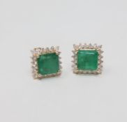 A pair of 14ct yellow gold emerald and diamond earrings featuring 1 square cut emeralds 3.