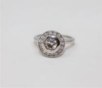 An 18ct white gold diamond ring featuring one round brilliant cut diamond 0.