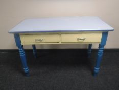 A 20th century pine two drawer kitchen with formica top