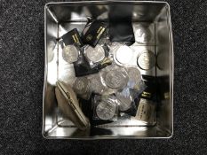 A tin containing a quantity of British Crowns,