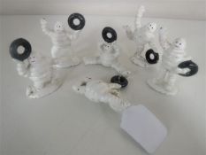 Six cast iron Michelin figures