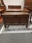 A George III panelled oak coffer,