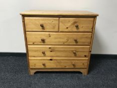A pine five drawer chest