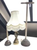 A cherub table lamp together with two vintage poss sticks
