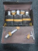 A vintage leather cased drinks set CONDITION REPORT: The case measures 30cm by 19cm