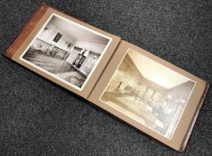 An antique leather bound photograph album by J. T.