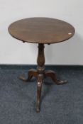 A George III oak pedestal tilt topped table