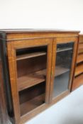 An Edwardian oak double door bookcase