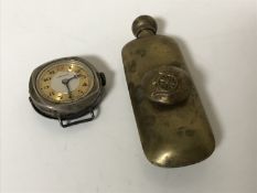 A WWI brass artillery oiler together with a WWI silver trench watch