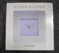 Four boxed Royal Crest mirror clocks together with two Leonardo collection silver glitter clocks