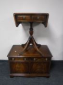 A Reprodux double door low cabinet and matching flap sided occasional table