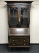 An Edwardian oak bureau bookcase